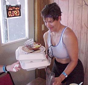 Denise bussing the table